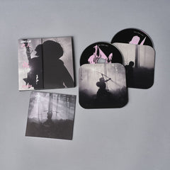 Collection of artistic prints or canvases featuring silhouetted figures in moody, atmospheric scenes.