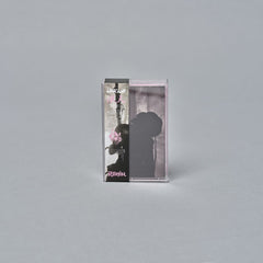 Cassette tape case with a silhouette and guitar image on the cover.