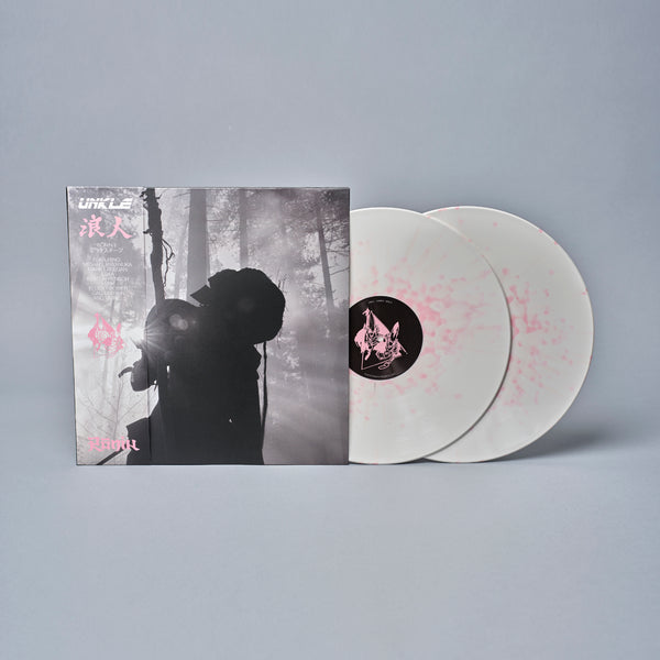 Vinyl record album with cover art featuring a silhouetted figure in a misty forest.