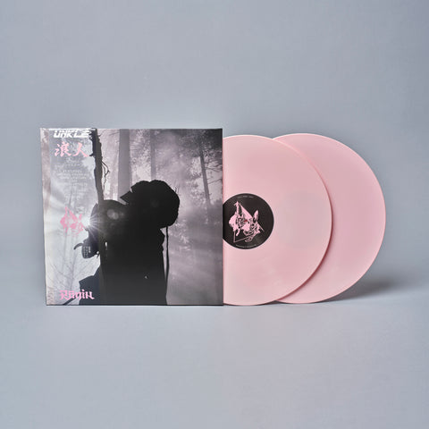 Pink vinyl record album with a moody black and white forest scene on the cover.