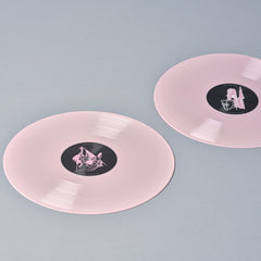 Pink vinyl records with black labels.